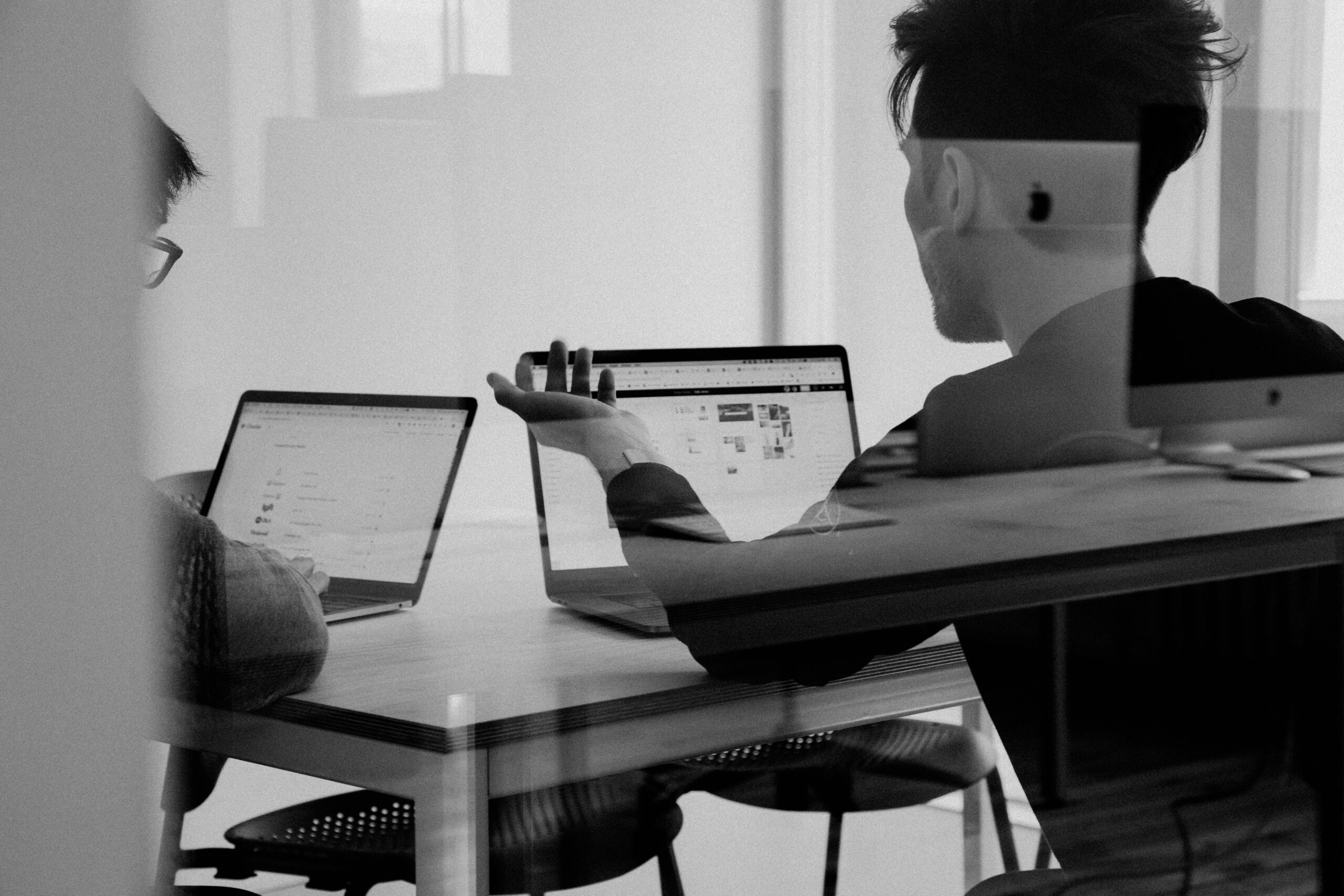 Image of 2 person taking about automating IT processes